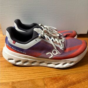 On Running Red and Purple Athletic Shoes